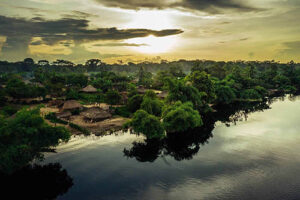 a body of water with trees and buildings